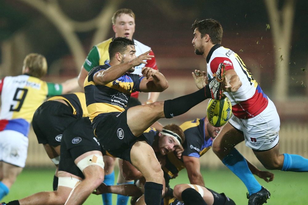 Ryan Louwrens tries to get a kick away when the Spirit and Rays met in Round Two. Photo: Getty Images