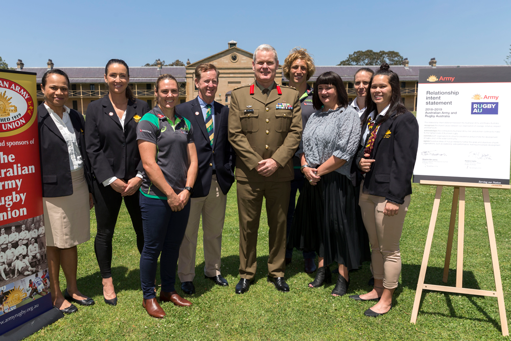 Brigadier Ben James, Rugby AU CEO Raelene Castle and Australian Sevens players and Wallaroos. Photo: Ray Vance