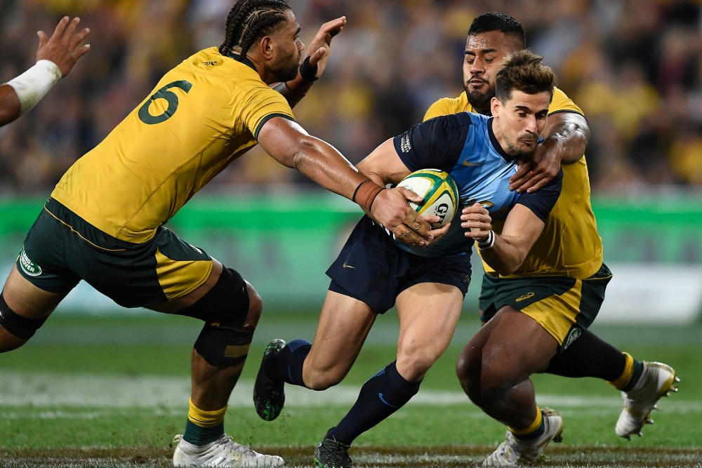 Taniela Tupou (right) and Lukhan Salakaia-Loto (left) tackle an Argentinian opponent in The Rugby Championship match in Brisbane. Photo: Getty Images 
