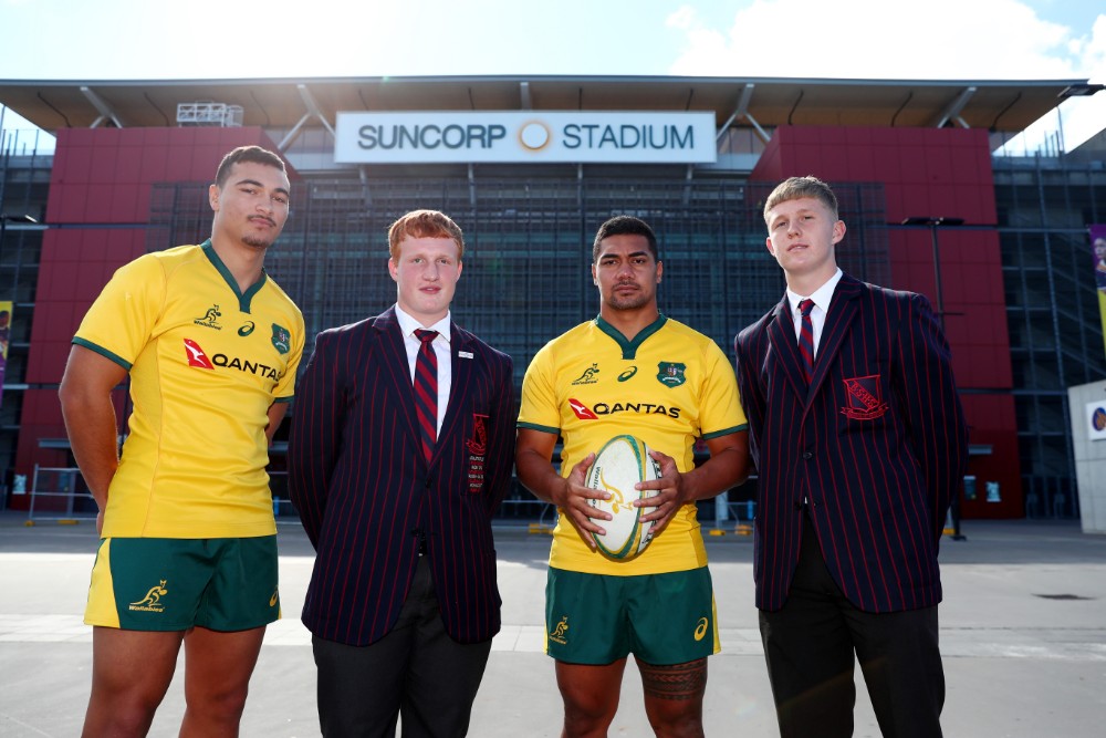 Chris Feauai-Sautia (with ball) and Jordan Petaia (left) promoting the clash of their old school Brisbane State High and Nudgee College in a curtain-raiser to the Wallabies-Argentina Test alongside State High students Wian Joubert (at left) and Moses Jones. Photo: Getty Images