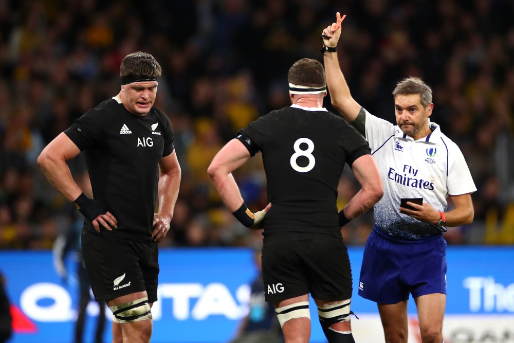 French referee Jerome Garces shows Scott Barrett a red card after his hit on Wallabies skipper Michael Hooper. Photo: Getty Images 