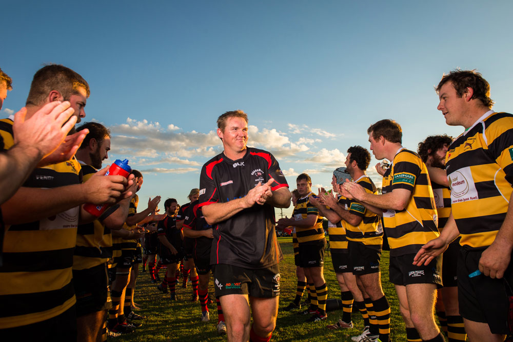 Narromine captain-coach Craig Campbell leads his team off the field after the 47-3 triumph in Trangie.