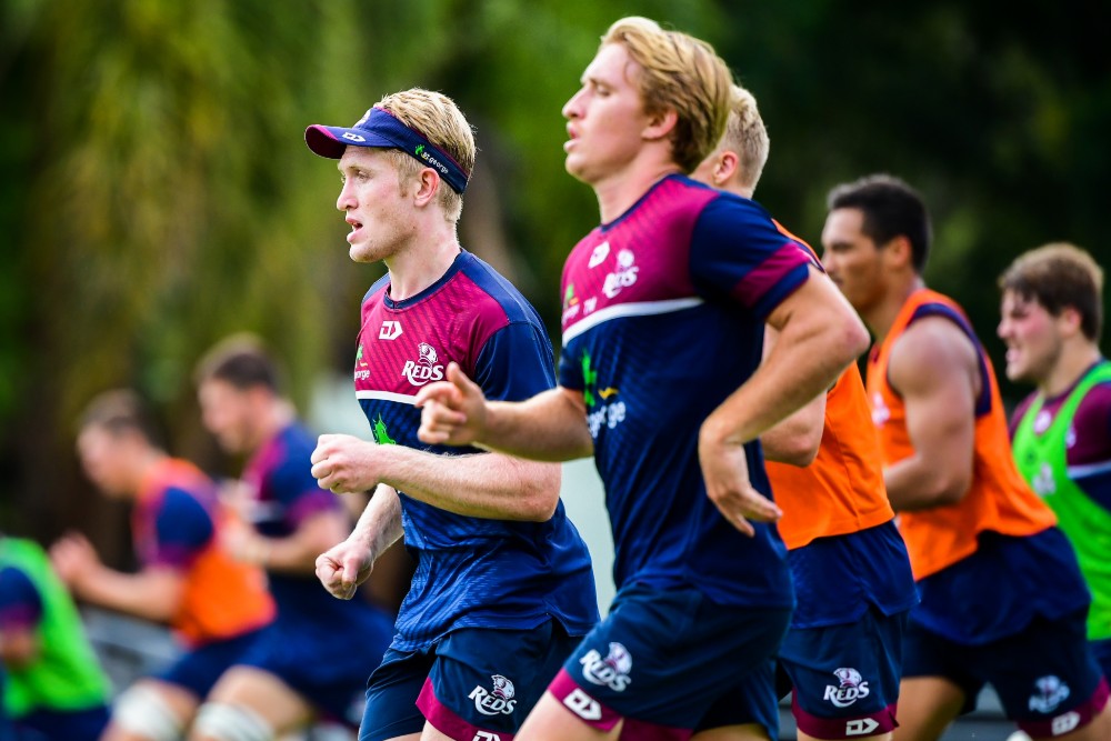 reds players Isaac Lucas and Tate McDermott toiling in the pre-season heat. Photo: RUGBY.com.au/Stuart Walmsley